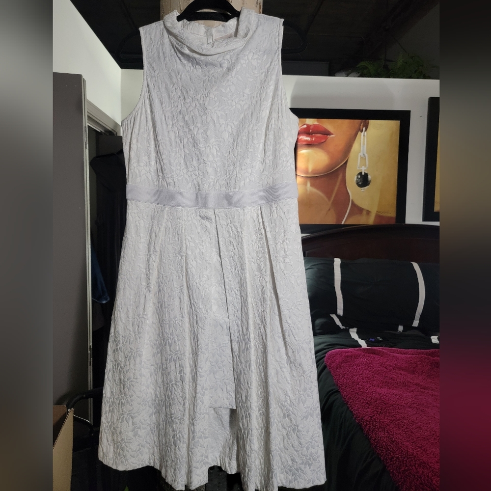 Eva Mendes White Dress with a cover of longer than the shorter portion.